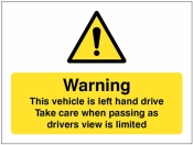 This vehicle is left-hand drive take care when passing as drivers view is limited sign