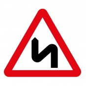 Double bend ahead left then right road sign (513)