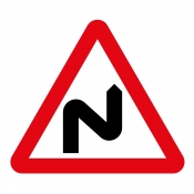 Double bend ahead right then left road sign (513)