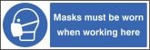 Masks must be worn when working here sign