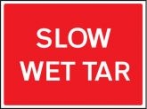 Slow wet tar road sign