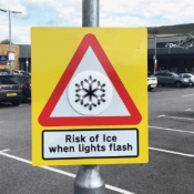 Ice warning sign with flashing lights