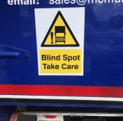 Blind spot take care sign