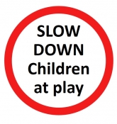 Slow down children at play sign
